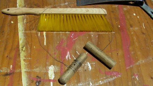 I wound some stainless steel wire around some cut broomstick ends.  I'll see-saw it back and forth to cut through comb.