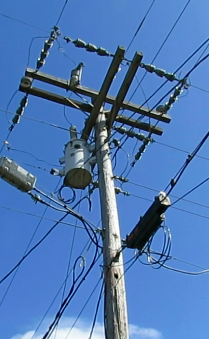 This power pole has been deemed unsafe.  The power company says it's 50 to 60 years old.  I'm wondering if it dates back to the Rural Electrification 