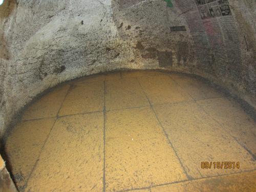 The sand is out!!!  You can see the newspaper layer that we put down is intact, so I managed to remove the sand without messing up the inner surface (for the most part).  Now I'll peel the paper off and work on polishing the inside of the dome...