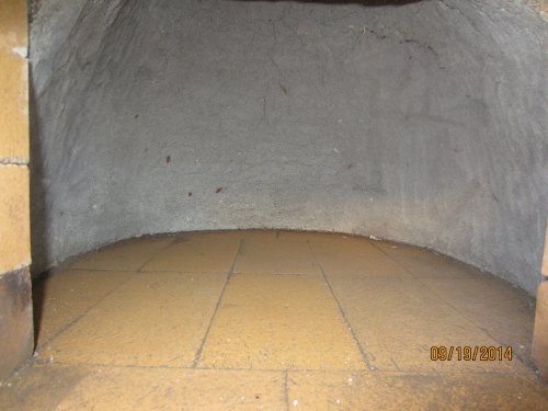 The sand and newspaper has been removed from the oven cavity.  The inside of the dome isn't dry yet, so I was a little concerned it might slump.  