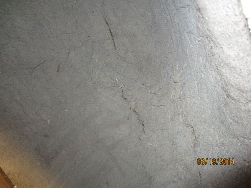 As the inside dries (the outside was significantly drier by now) some cracks form.  I don't want sand and clay to spill off of the dome into our food, so I set about filling in the cracks with some wet thermal mix and massaging it in with the back of a serving spoon.