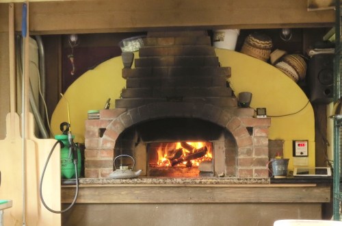 It took about six months for Seth to build his Alan Scott wood-fired bread oven and the shop that serves as his kitchen. My daily walks would take me by his place.  I watched as he built the roof.  It was meticulously built on the ground with beautiful jointing.  I wondered how he was going to lift it up to the top.  One day, as we walked past, there it was connected to the uprights.  I asked him how he got it up there.  His reply..."one piece at a time."  "I built it on the ground to make sure it was right."