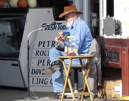It was one of those perfect days when everyone was in a good mood with the weather being warm, artists selling their crafts, and Kirk Schumacher strumming his guitar.  I asked Kirk if he would sing one of my favorite summertime songs.  Without missing a beat, he he belted out "Summertime."
