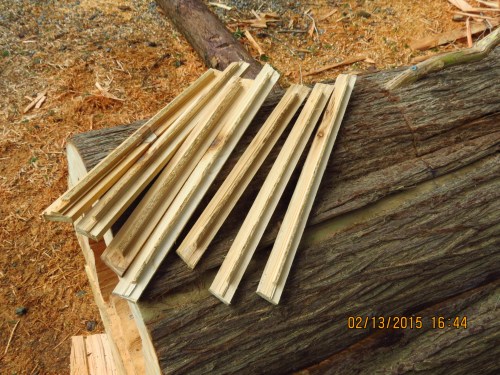 My neighbor wanted to get some scrap cedar out of the way, which he donated to me.  I cut my top bars.