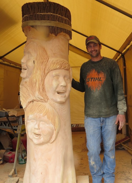 March 17th...Since it was my birthday, I skipped work to see how Brian was progressing on the faces. The 'quilt box' has been added on top and Brian is figuring out what kind of carving he will add to the very top to shed rainwater and add another uniqueness to my already very unique hive.